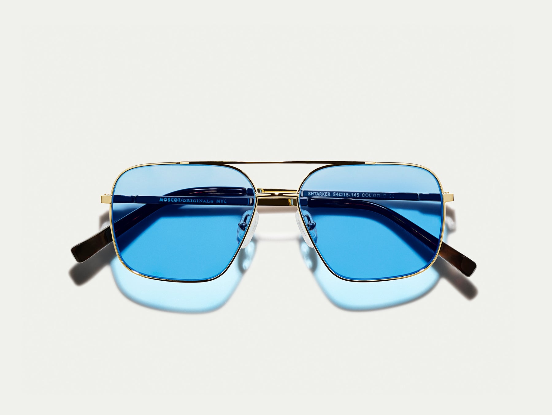 The SHTARKER in Gold with Celebrity Blue Tinted Lenses The SHTARKER in Gold with Celebrity Blue Tinted Lenses