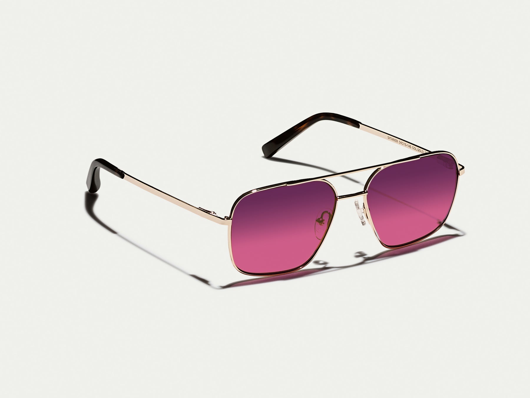 The SHTARKER in Gold with Westside Sunset Tinted Lenses The SHTARKER in Gold with Westside Sunset Tinted Lenses