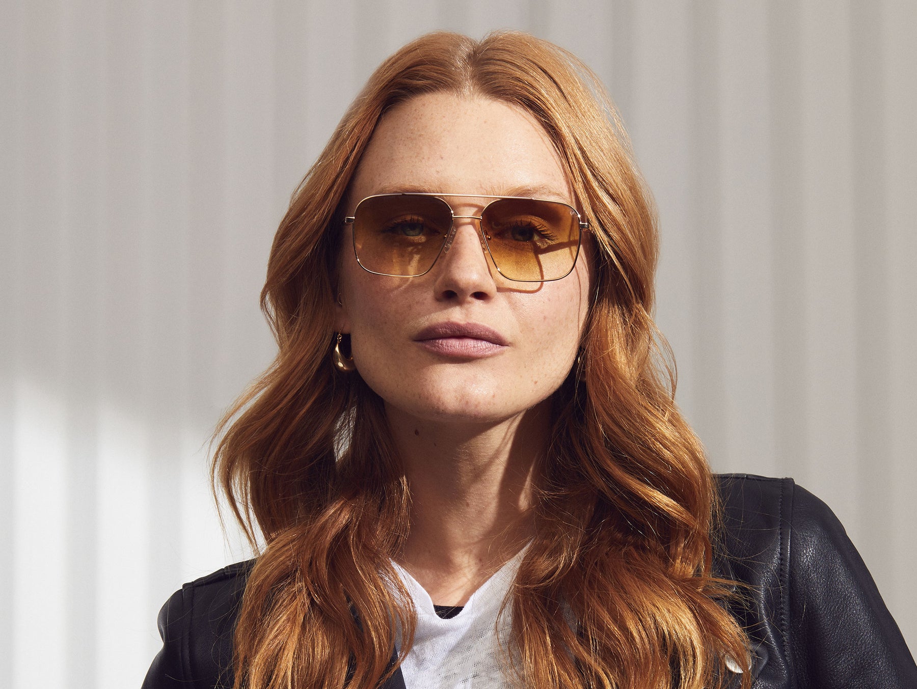 Model is wearing The SHTARKER in size 54 in Gold with Chestnut Fade Tinted Lenses Model is wearing The SHTARKER in size 54 in Gold with Chestnut Fade Tinted Lenses