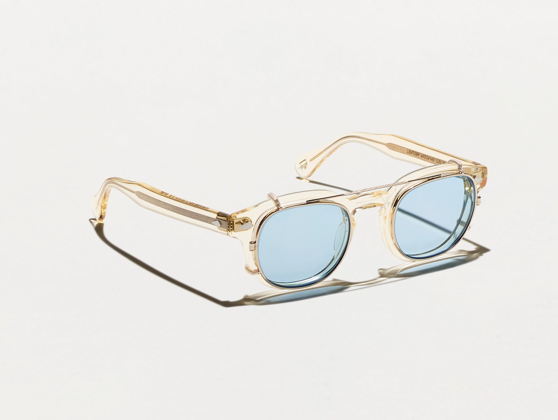 The CLIPTOSH in Gold with Bel Air Blue Tinted Lenses The CLIPTOSH in Gold with Bel Air Blue Tinted Lenses