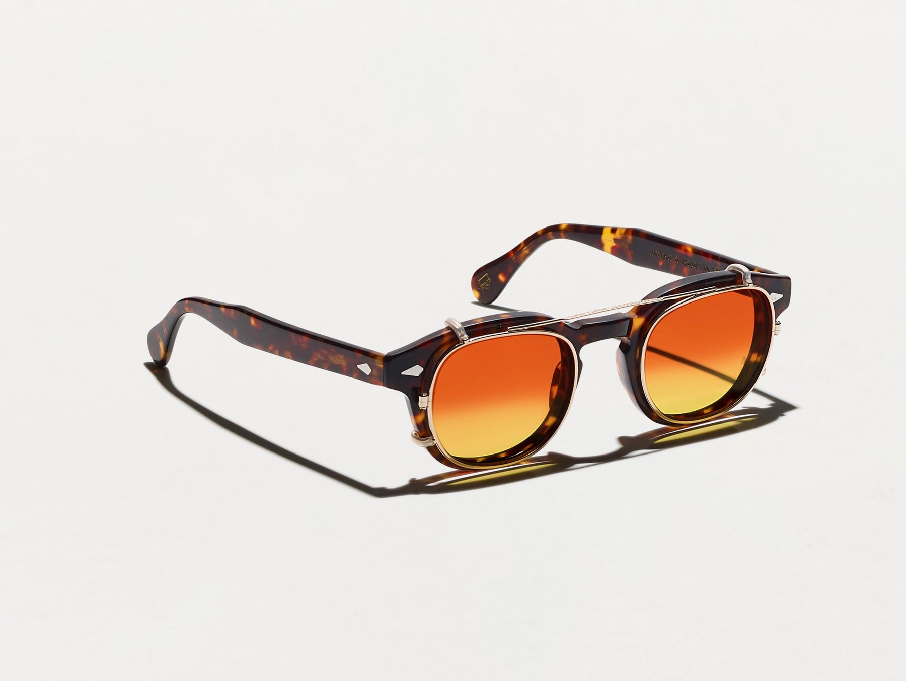 The CLIPTOSH in Gold with Candy Corn Tinted Lenses The CLIPTOSH in Gold with Candy Corn Tinted Lenses