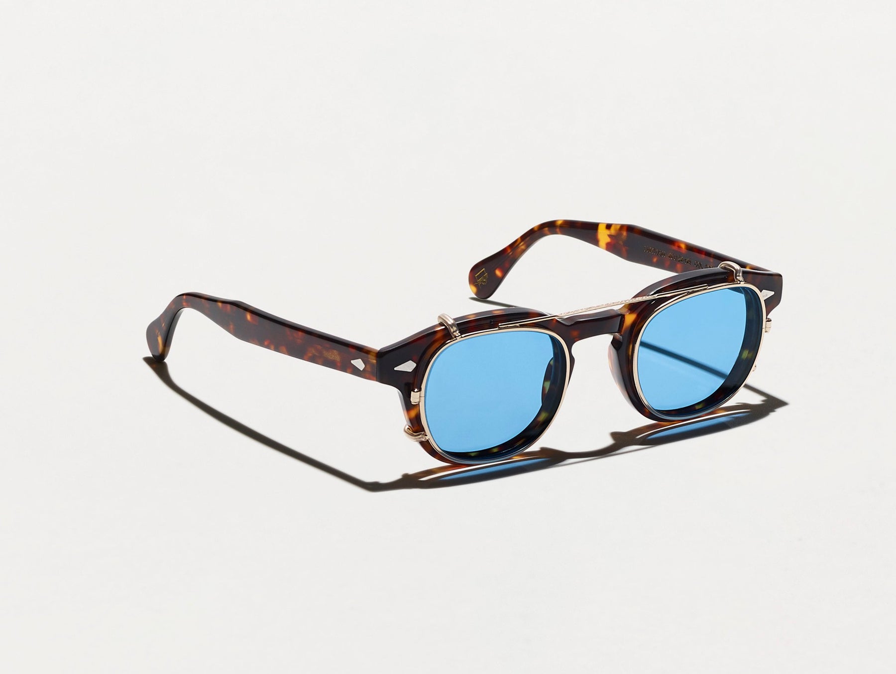 The CLIPTOSH in Gold with Celebrity Blue Tinted Lenses The CLIPTOSH in Gold with Celebrity Blue Tinted Lenses