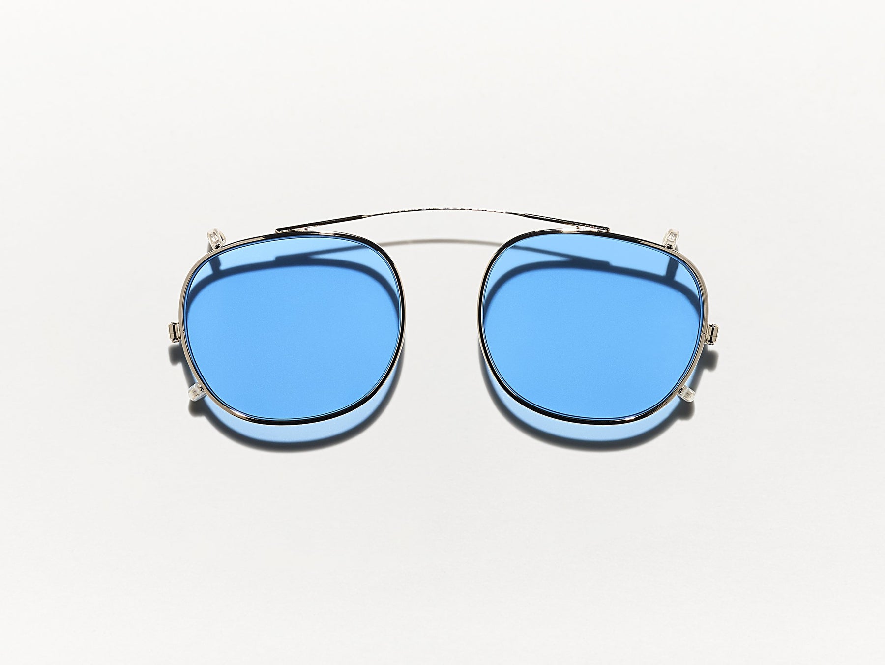 The CLIPTOSH in Gold with Celebrity Blue Tinted Lenses The CLIPTOSH in Gold with Celebrity Blue Tinted Lenses