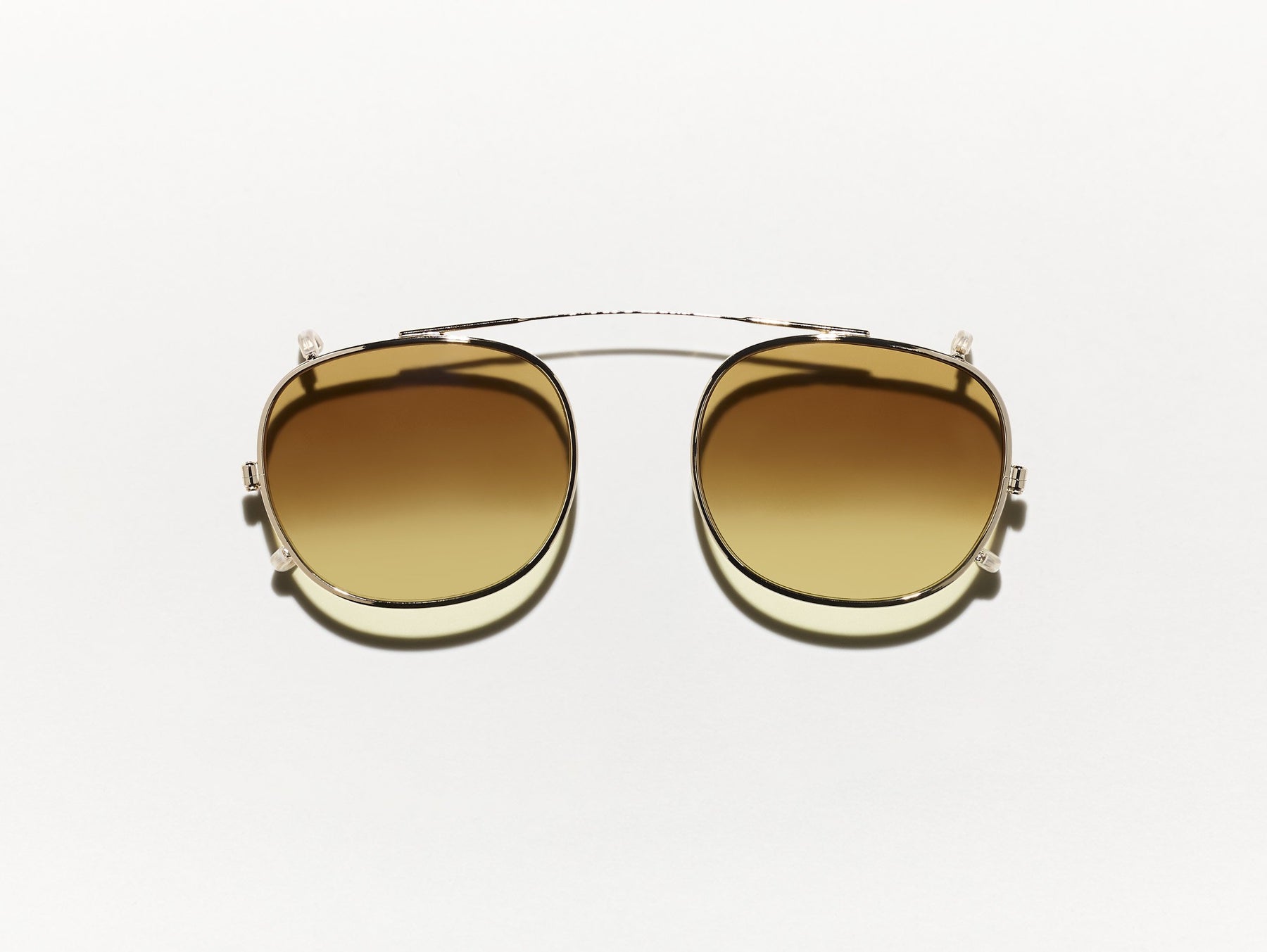The CLIPTOSH in Gold with Chestnut Fade Tinted Lenses The CLIPTOSH in Gold with Chestnut Fade Tinted Lenses