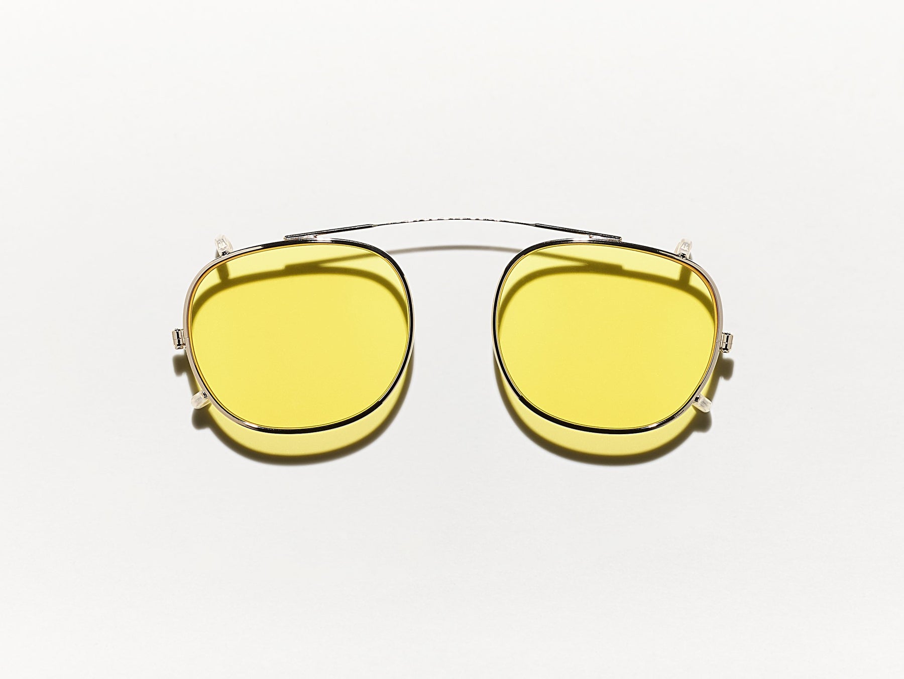 The CLIPTOSH in Gold with Mellow Yellow Tinted Lenses The CLIPTOSH in Gold with Mellow Yellow Tinted Lenses