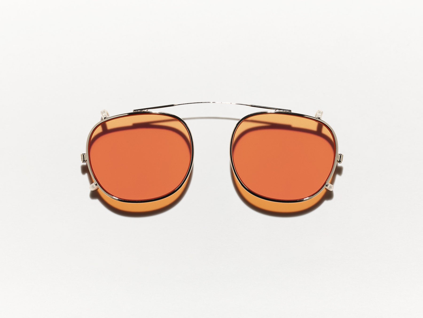 The CLIPTOSH in Gold with Woodstock Orange Tinted Lenses The CLIPTOSH in Gold with Woodstock Orange Tinted Lenses