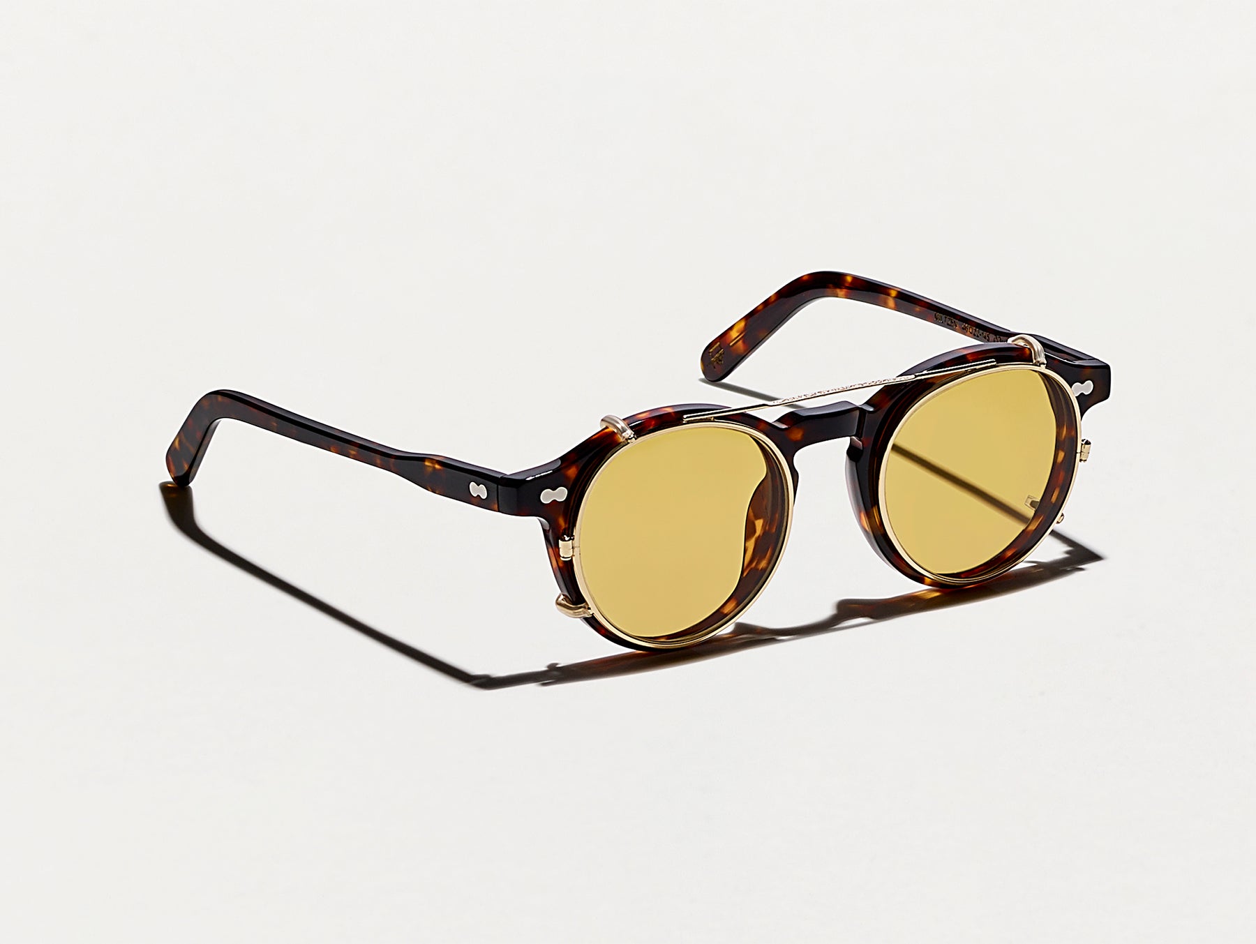The CLIPZEN in Gold with Amber Tinted Lenses The CLIPZEN in Gold with Amber Tinted Lenses