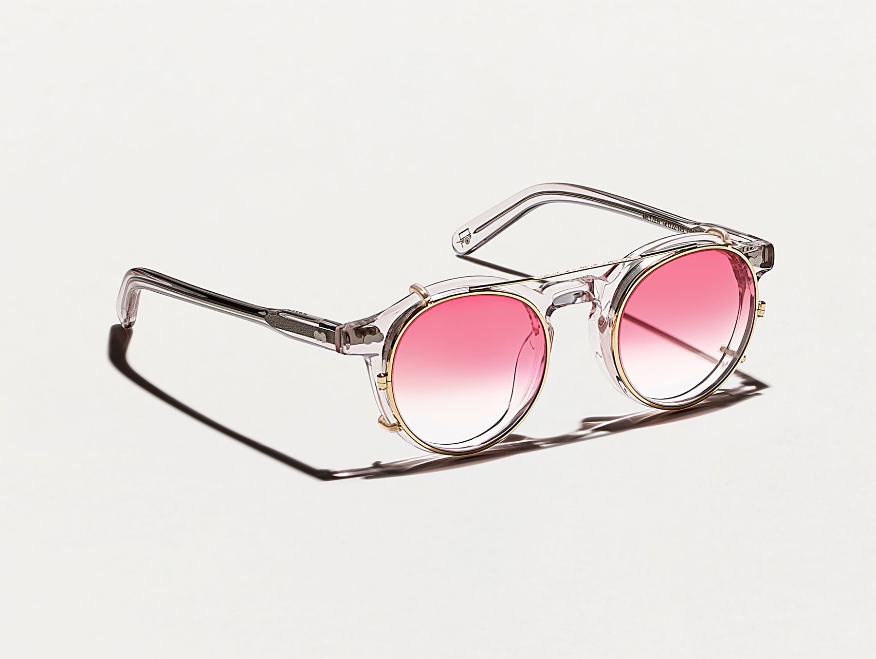 The CLIPZEN in Gold with Big Apple Fade Tinted Lenses The CLIPZEN in Gold with Big Apple Fade Tinted Lenses