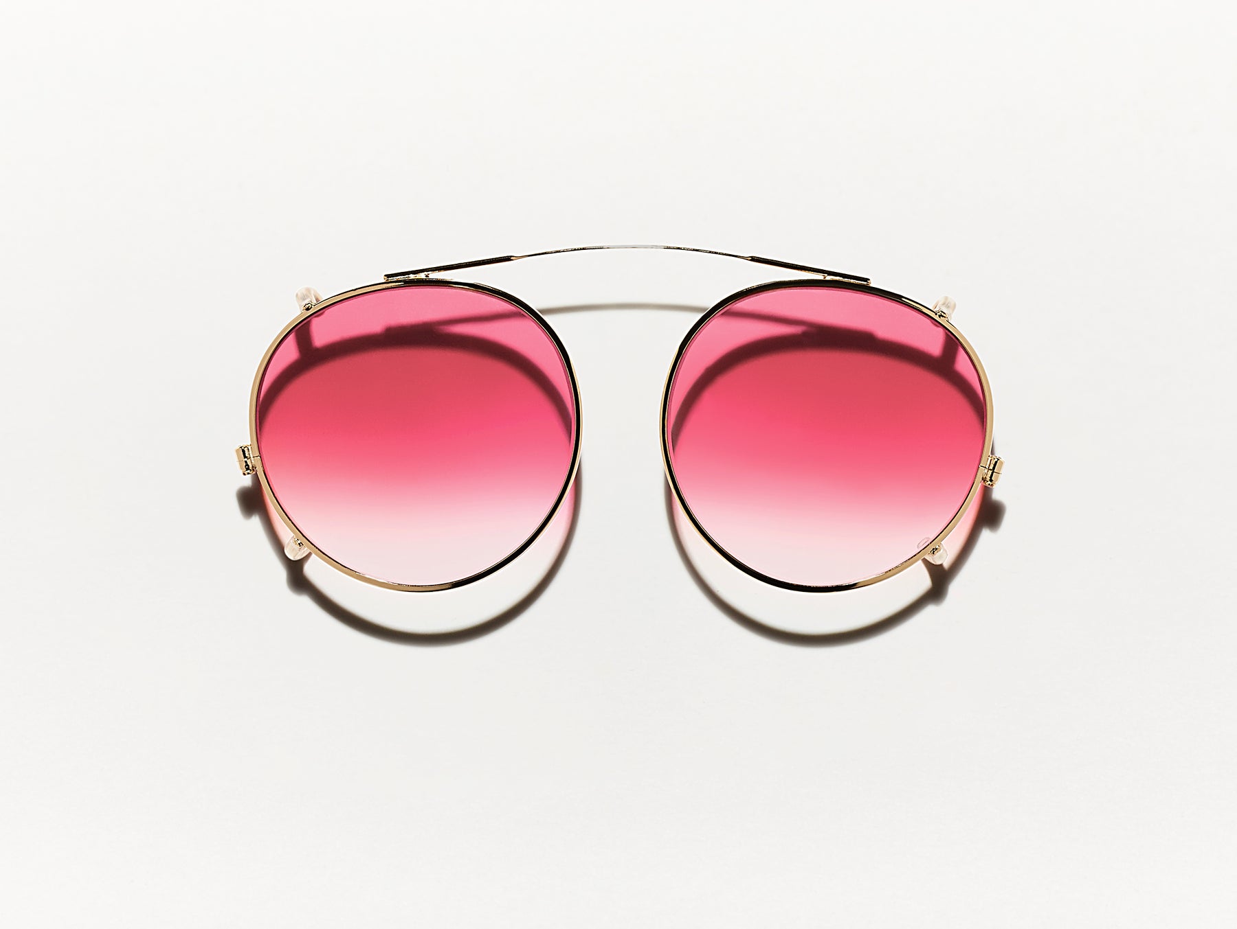 The CLIPZEN in Gold with Big Apple Fade Tinted Lenses The CLIPZEN in Gold with Big Apple Fade Tinted Lenses