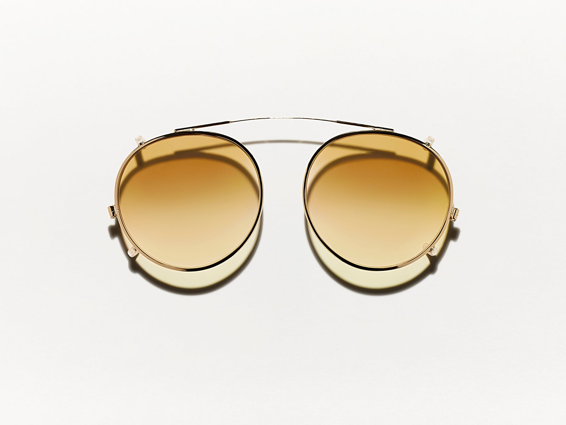 The CLIPZEN in Gold with Chestnut Fade Tinted Lenses The CLIPZEN in Gold with Chestnut Fade Tinted Lenses