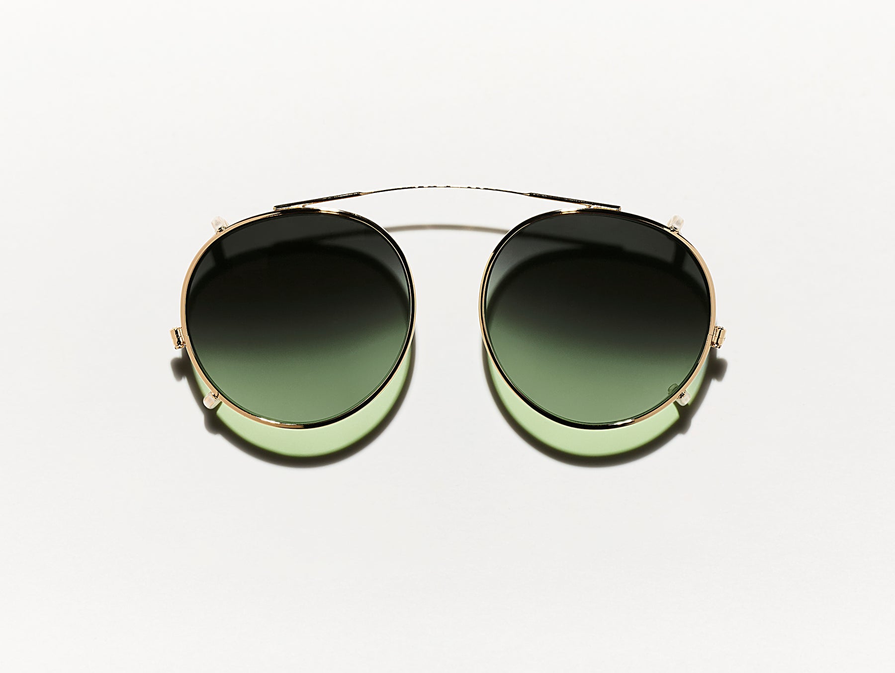 The CLIPZEN in Gold with Forest Wood Tinted Lenses The CLIPZEN in Gold with Forest Wood Tinted Lenses