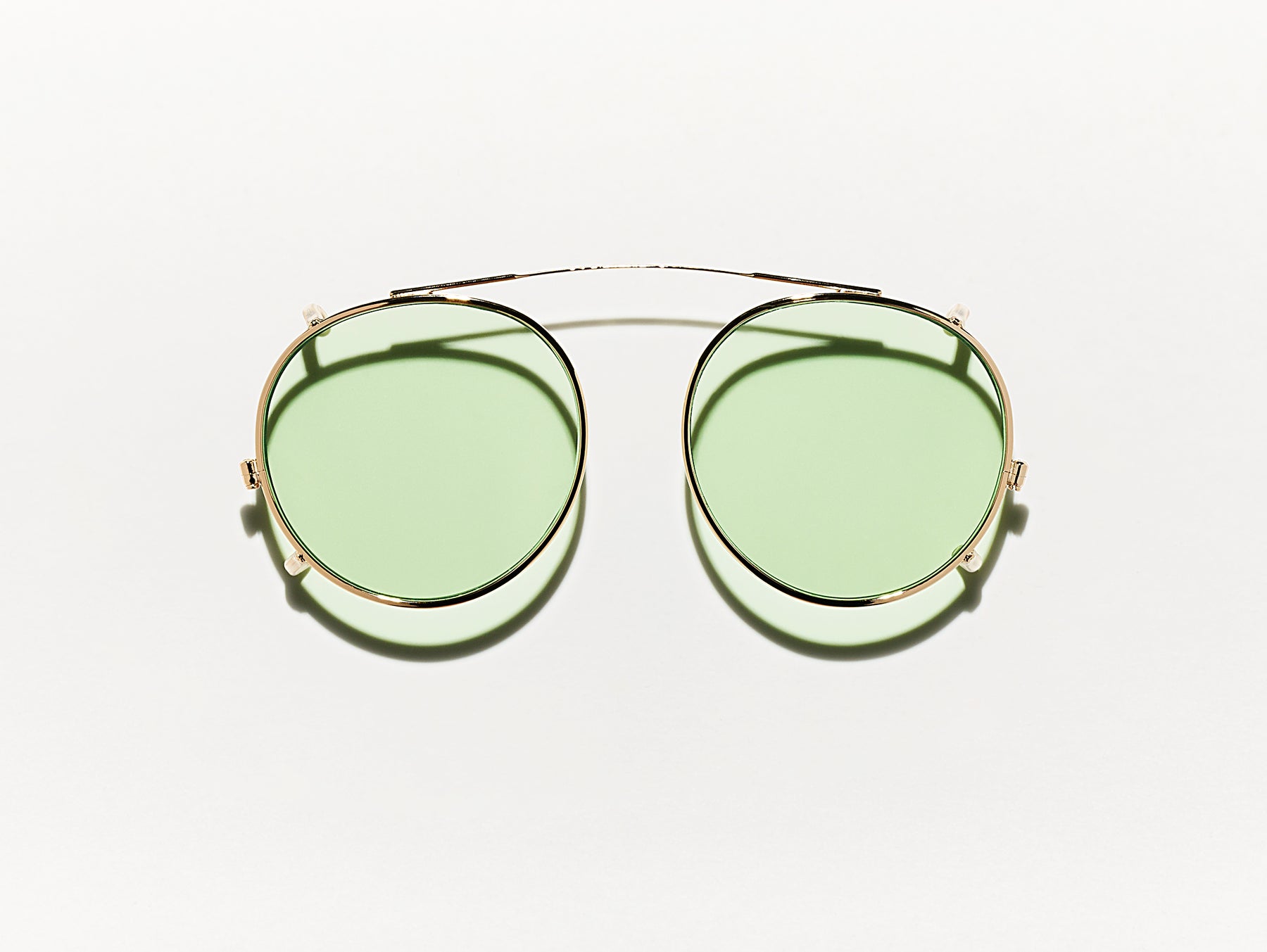 The CLIPZEN in Gold with Limelight Fade Tinted Lenses The CLIPZEN in Gold with Limelight Fade Tinted Lenses