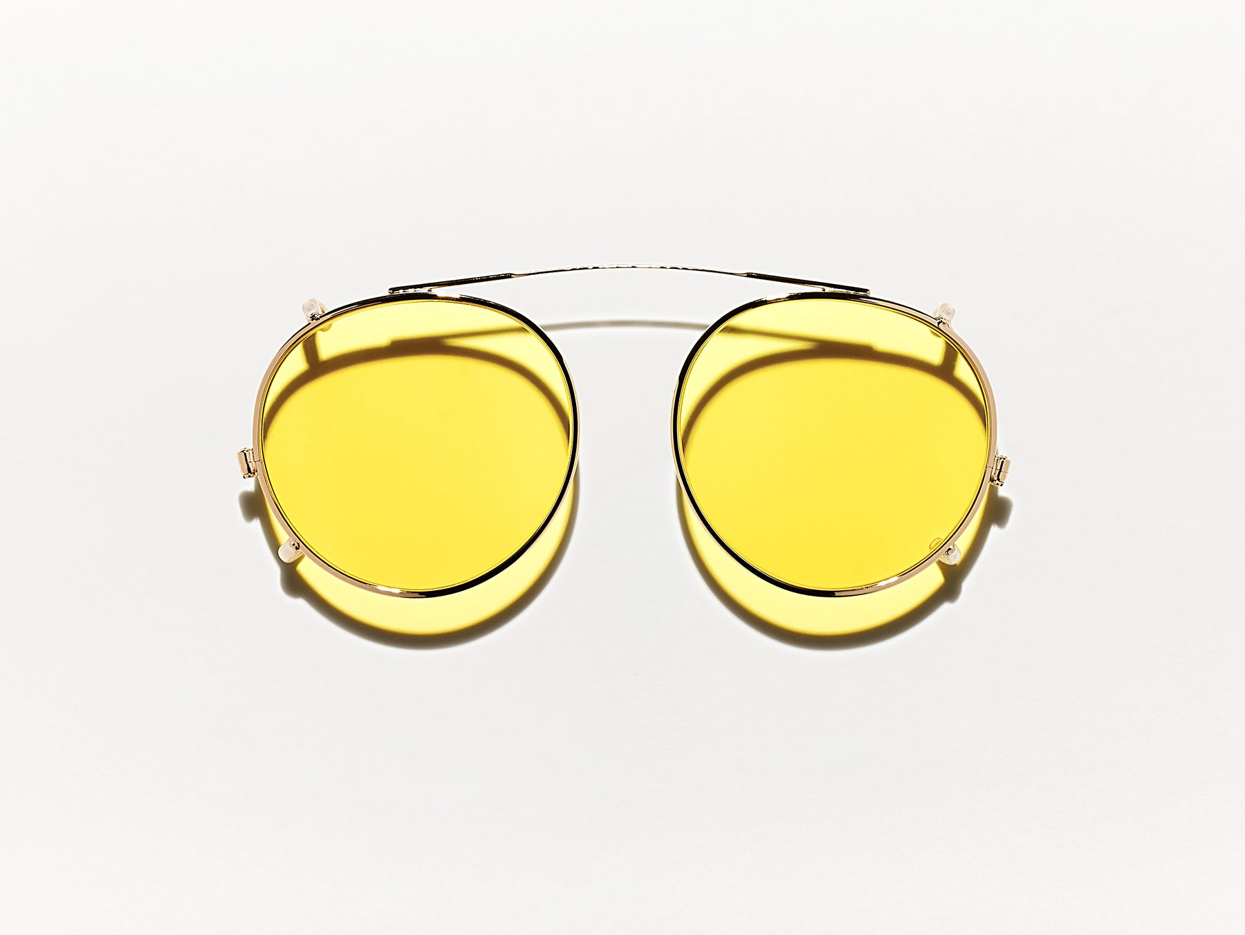 The CLIPZEN in Gold with Mellow Yellow Tinted Lenses The CLIPZEN in Gold with Mellow Yellow Tinted Lenses