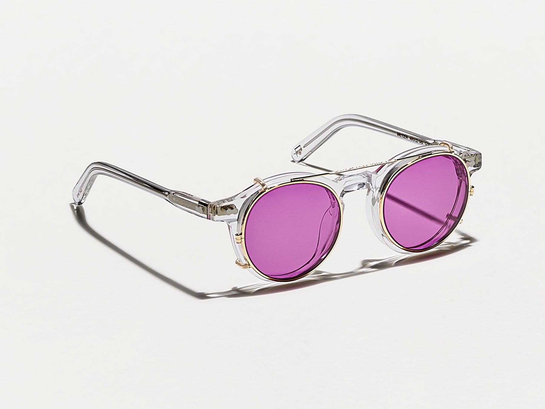 The CLIPZEN in Gold with Purple Nurple Tinted Lenses The CLIPZEN in Gold with Purple Nurple Tinted Lenses