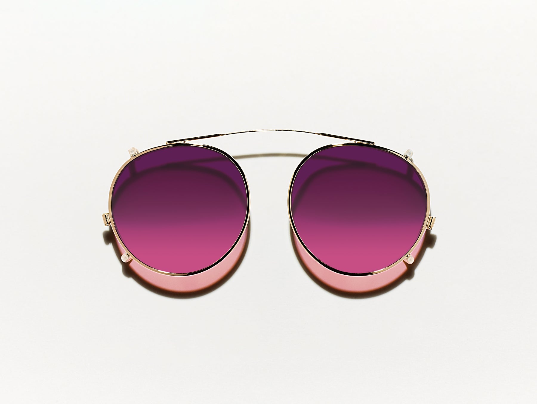 The CLIPZEN in Gold with Westside Sunset Tinted Lenses The CLIPZEN in Gold with Westside Sunset Tinted Lenses