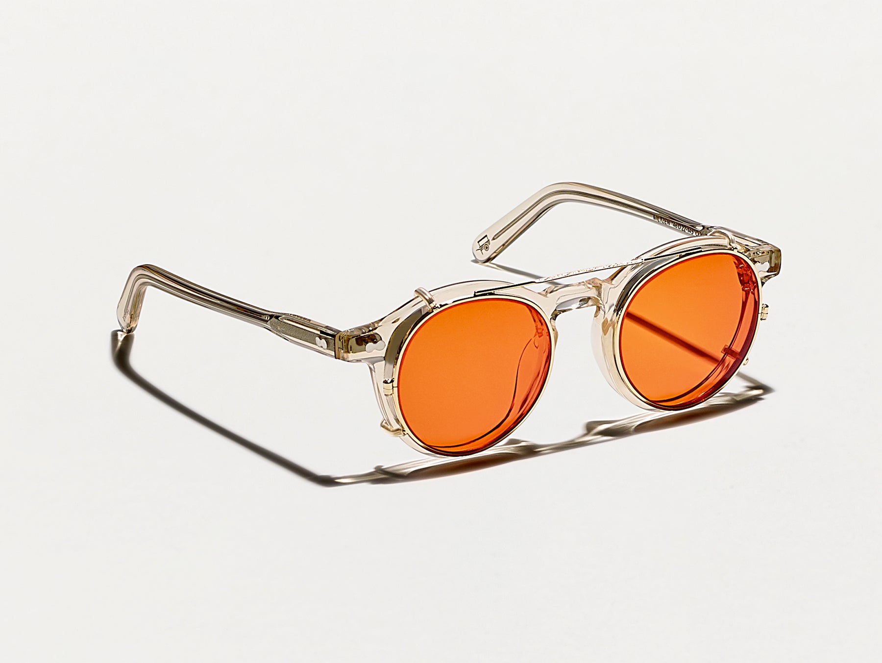 The CLIPZEN in Gold with Woodstock Orange Tinted Lenses The CLIPZEN in Gold with Woodstock Orange Tinted Lenses