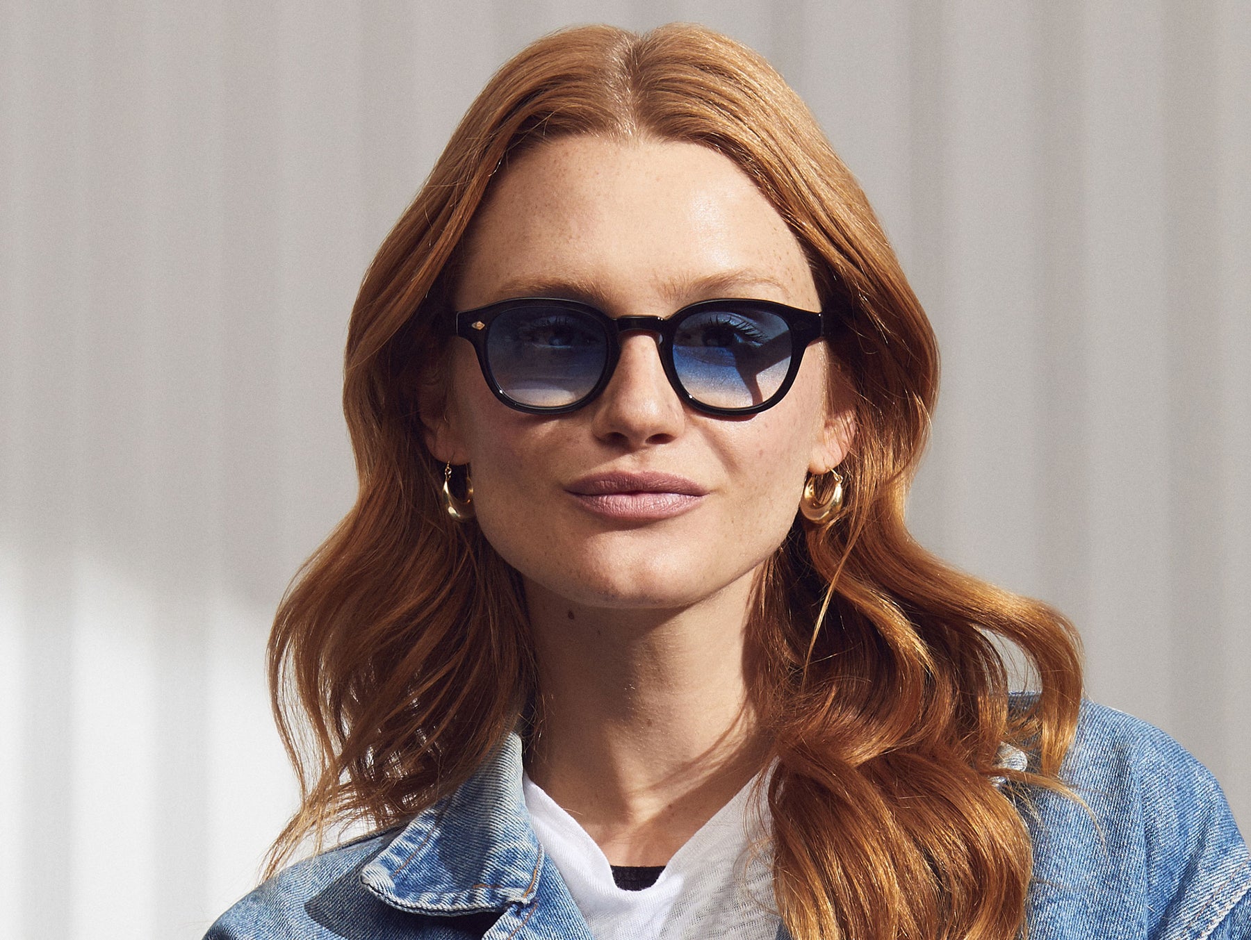 Model is wearing The LEMTOSH in Black in size 49 with Broadway Blue Fade Tinted Lenses Model is wearing The LEMTOSH in Black in size 49 with Broadway Blue Fade Tinted Lenses