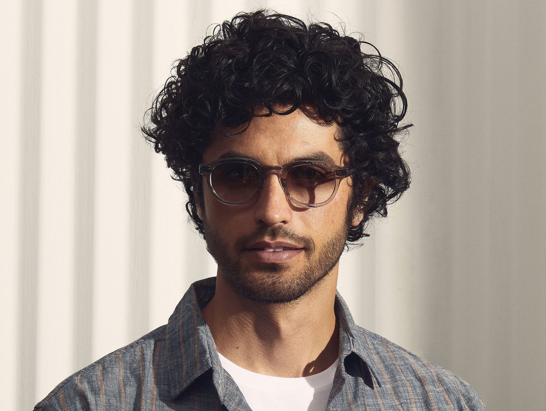 Model is wearing The LEMTOSH in Light Grey in size 46 with American Grey Fade Tinted Lenses Model is wearing The LEMTOSH in Light Grey in size 46 with American Grey Fade Tinted Lenses