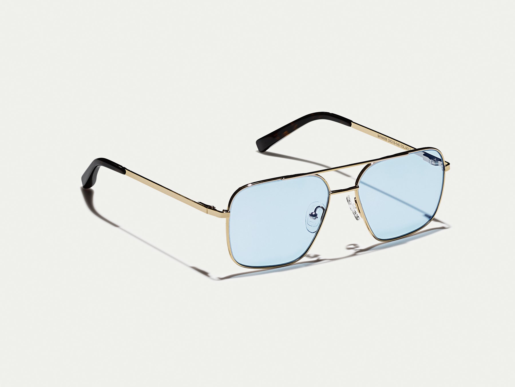 The SHTARKER in Gold with Bel Air Blue Tinted Lenses The SHTARKER in Gold with Bel Air Blue Tinted Lenses