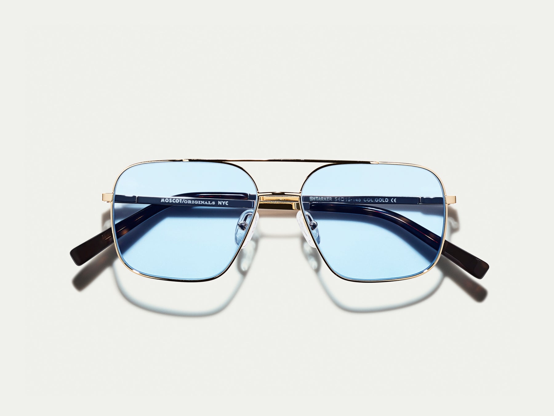 The SHTARKER in Gold with Bel Air Blue Tinted Lenses The SHTARKER in Gold with Bel Air Blue Tinted Lenses