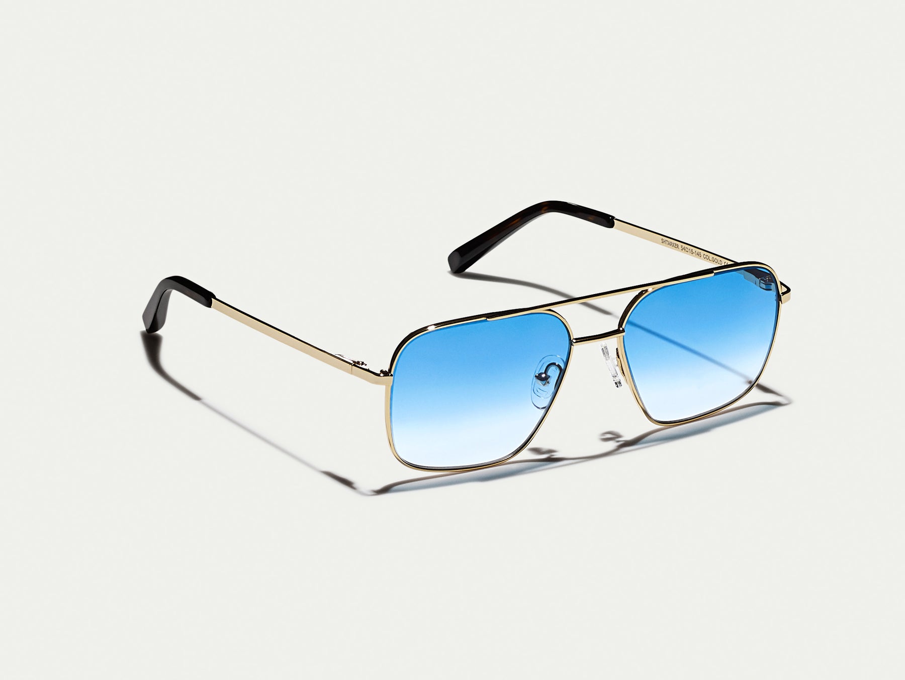 The SHTARKER in Gold with Broadway Blue Fade Tinted Lenses The SHTARKER in Gold with Broadway Blue Fade Tinted Lenses
