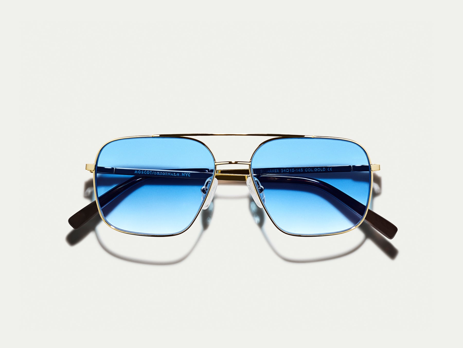 The SHTARKER in Gold with Broadway Blue Fade Tinted Lenses The SHTARKER in Gold with Broadway Blue Fade Tinted Lenses