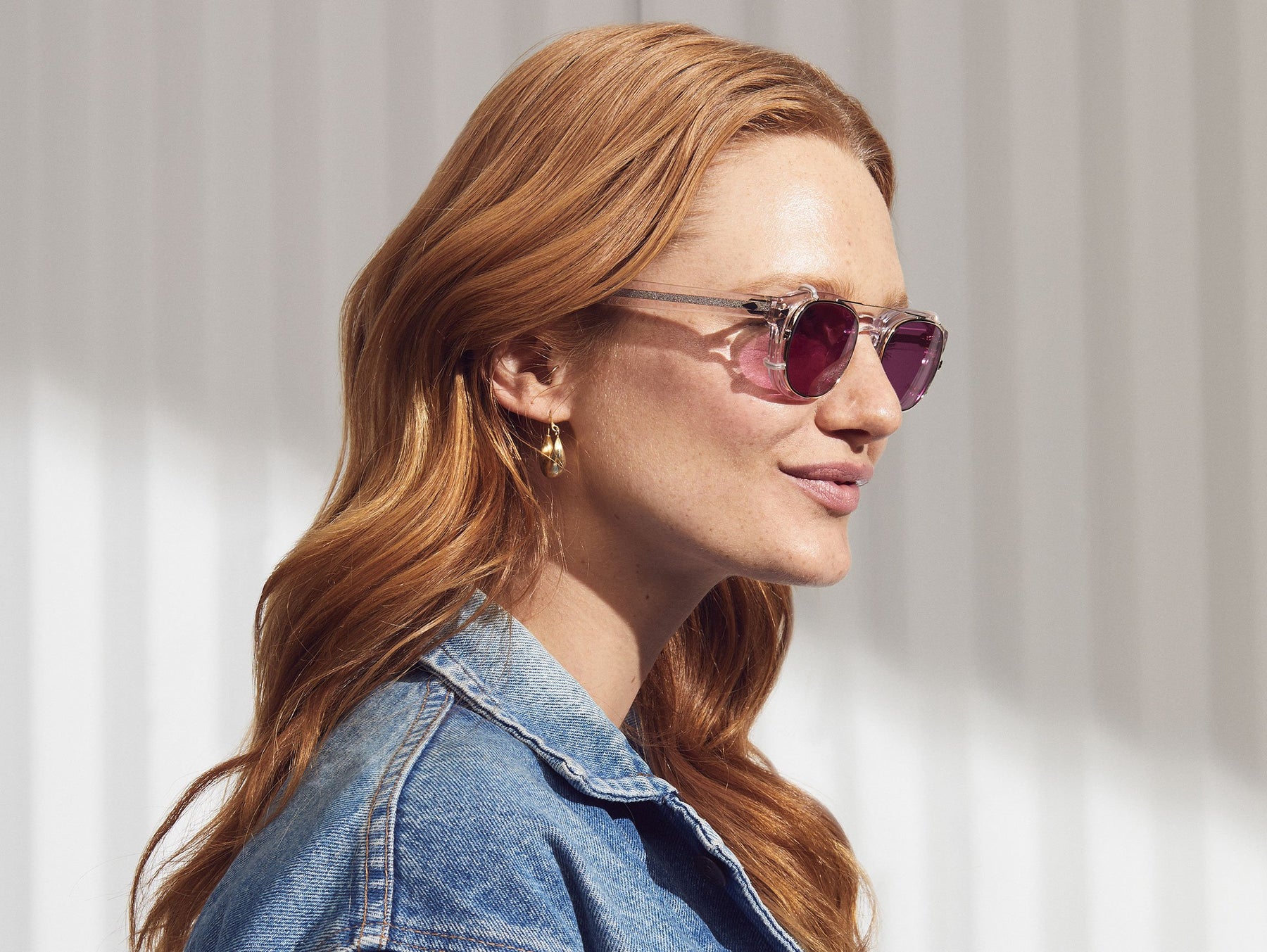 Model is wearing The CLIPTOSH in Gold in size 46 with Purple Nurple Tinted Lenses Model is wearing The CLIPTOSH in Gold in size 46 with Purple Nurple Tinted Lenses