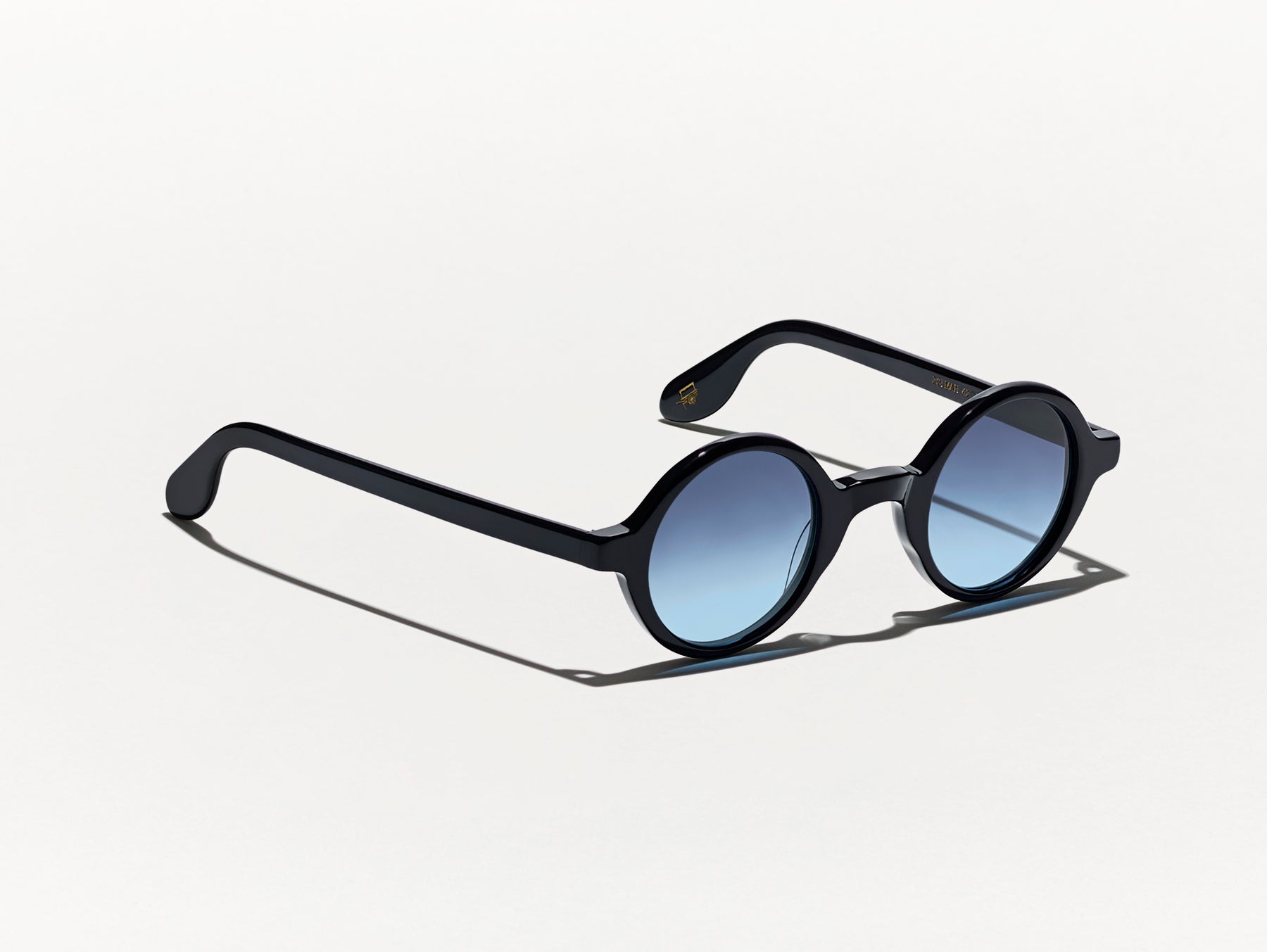 The ZOLMAN in Black with Denim Blue Tinted Lenses The ZOLMAN in Black with Denim Blue Tinted Lenses