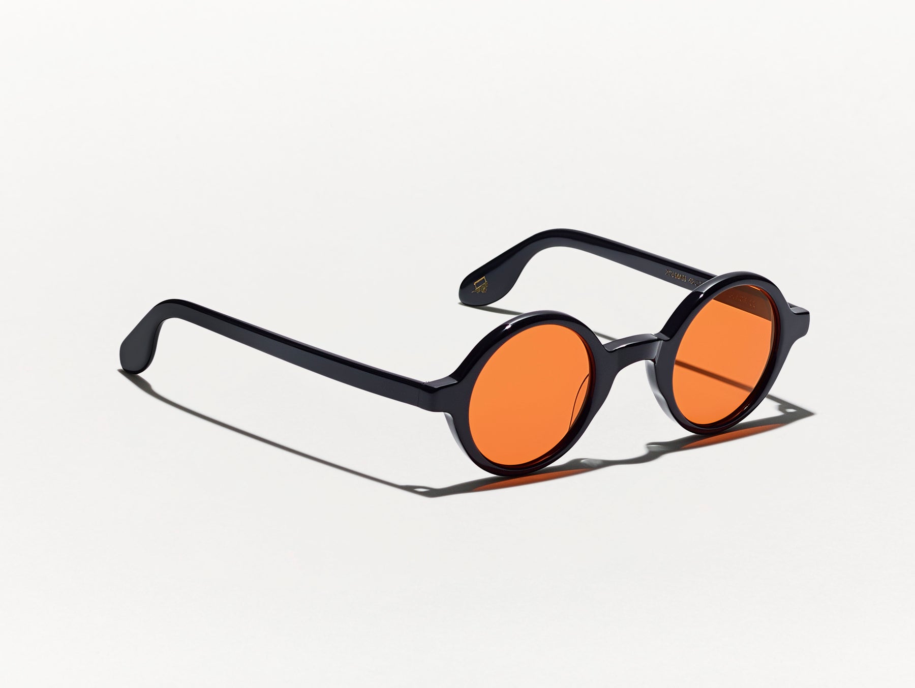 The ZOLMAN in Black with Woodstock Orange Tinted Lenses The ZOLMAN in Black with Woodstock Orange Tinted Lenses