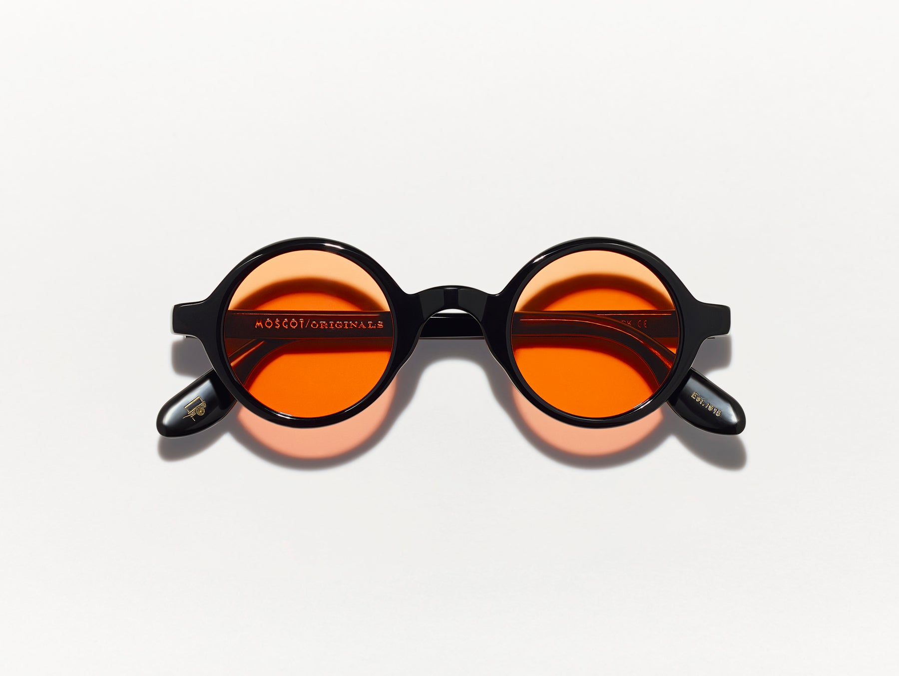 The ZOLMAN in Black with Woodstock Orange Tinted Lenses The ZOLMAN in Black with Woodstock Orange Tinted Lenses
