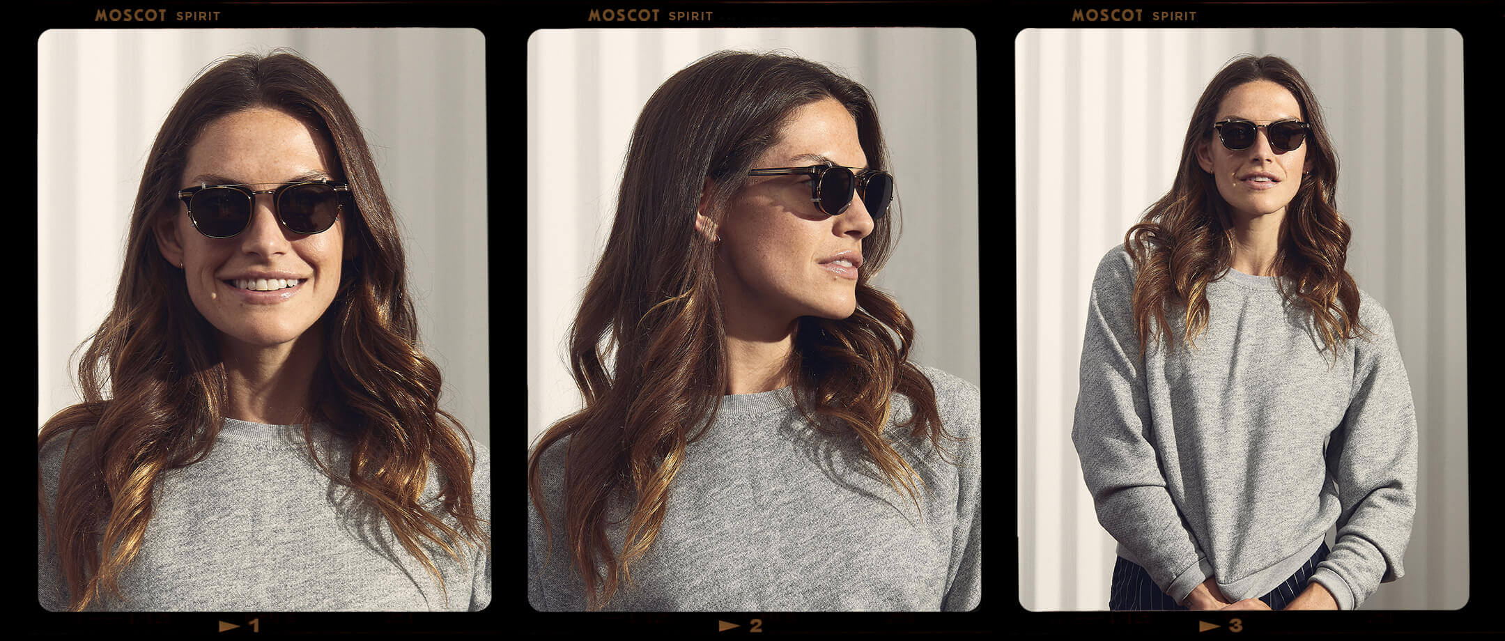 Model is wearing the STEVIE CLIP in Antique Gold in size 45 with Grey Lenses