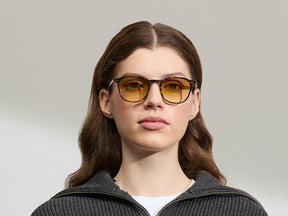 Model is wearing The ARTHUR in Tortoise in size 51 with Chestnut Fade Tinted Lenses