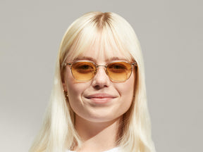 Model is wearing The AYGEN SUN in size 51 in Cinnamon with Chestnut Fade Tinted Lenses