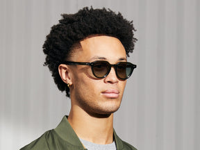 Model is wearing The BAITSIM SUN in Dark Green in size 48 with Forest Wood Tinted Lenses