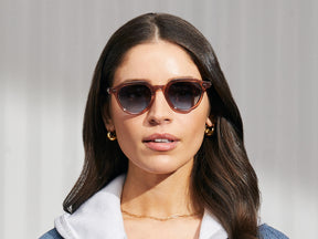 Model is wearing The BAITSIM SUN in Vintage Rose in size 48 with Denim Blue Tinted Lenses