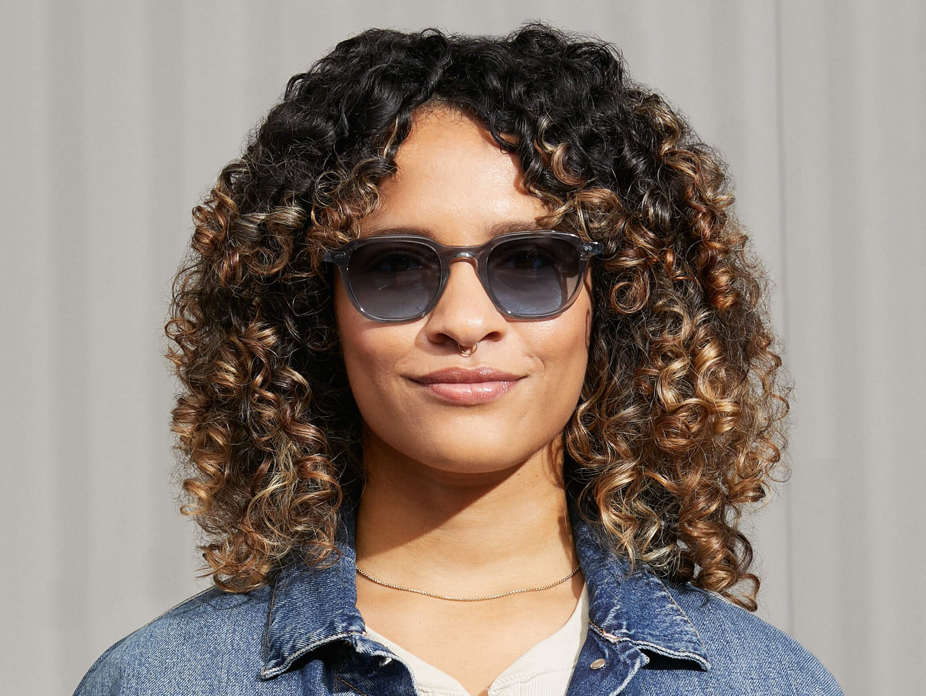 Model is wearing The BILLIK SUN in Light Blue in size 50 with Denim Blue Tinted Lenses