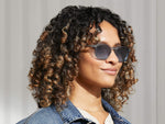 Model is wearing The BILLIK SUN in Light Blue in size 50 with Denim Blue Tinted Lenses