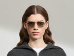 Model is wearing The BISHEART SUN in size 52 in Cinnamon with Forest Wood Tinted Lenses