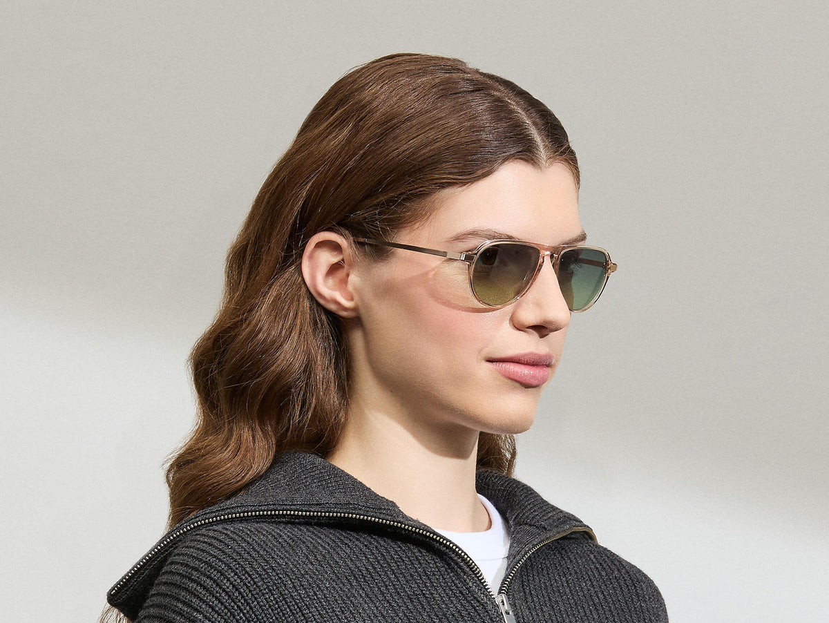 Model is wearing The BISHEART SUN in size 52 in Cinnamon with Forest Wood Tinted Lenses