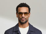 Model is wearing The BISHEART SUN in size 52 in Tortoise with Chestnut Fade Tinted Lenses