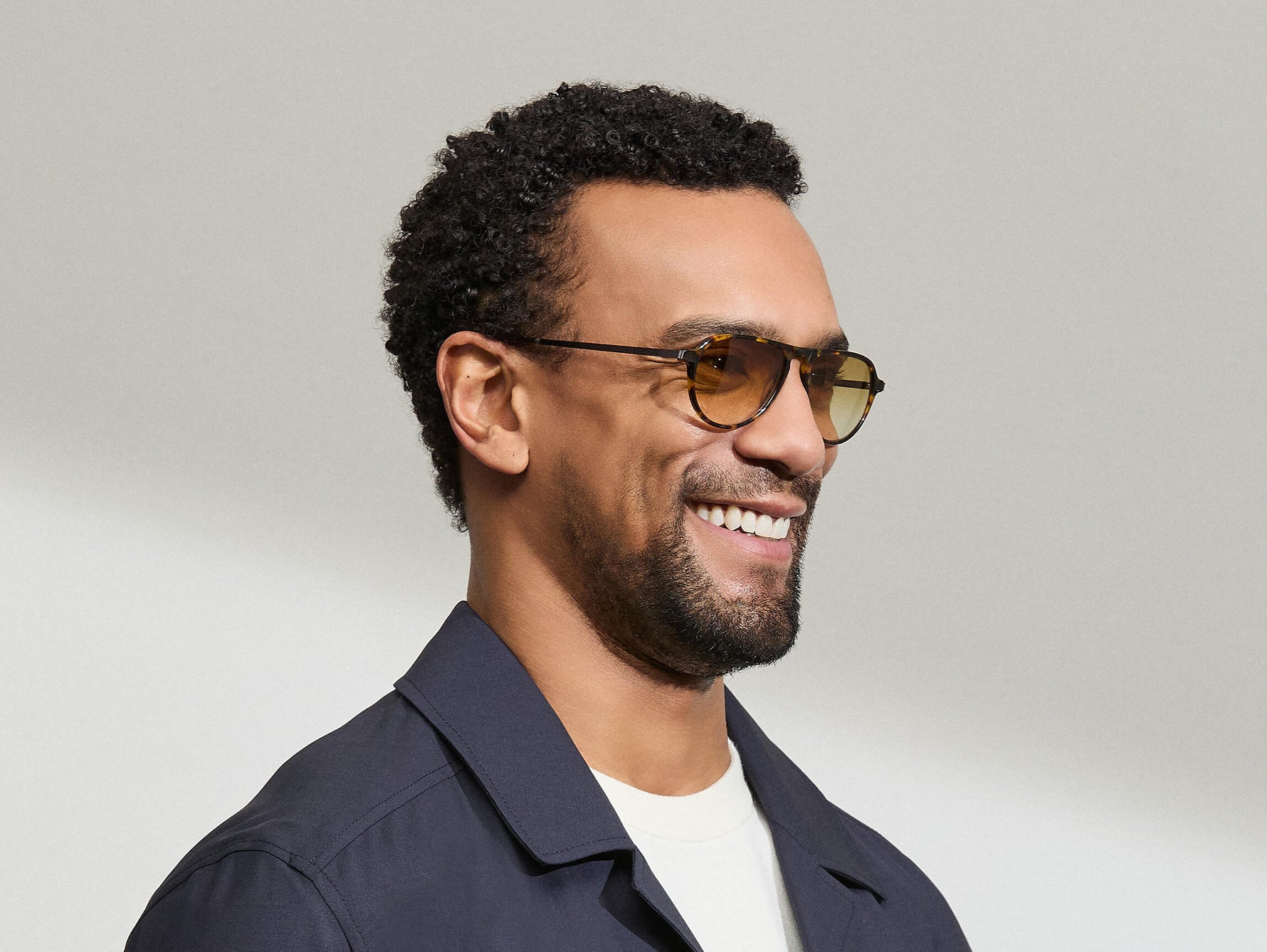 Model is wearing The BISHEART SUN in size 52 in Tortoise with Chestnut Fade Tinted Lenses