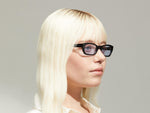 Model is wearing The BISSLE SUN in Black in size 48 with Bel Air Blue Tinted Lenses