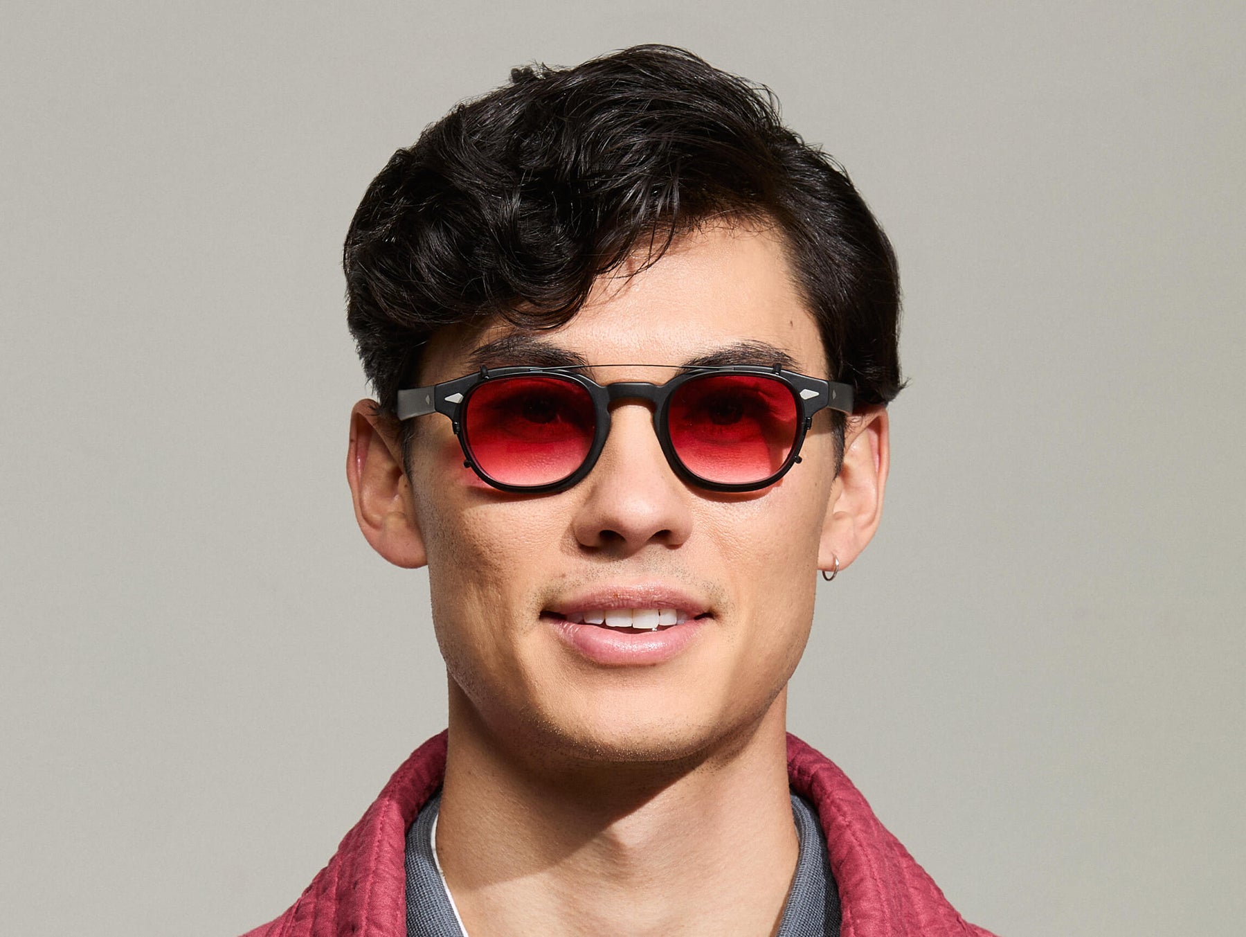 The Model is wearing The CLIPTOSH in Matte Black in size 46 with Big Apple Fade Tinted Lenses