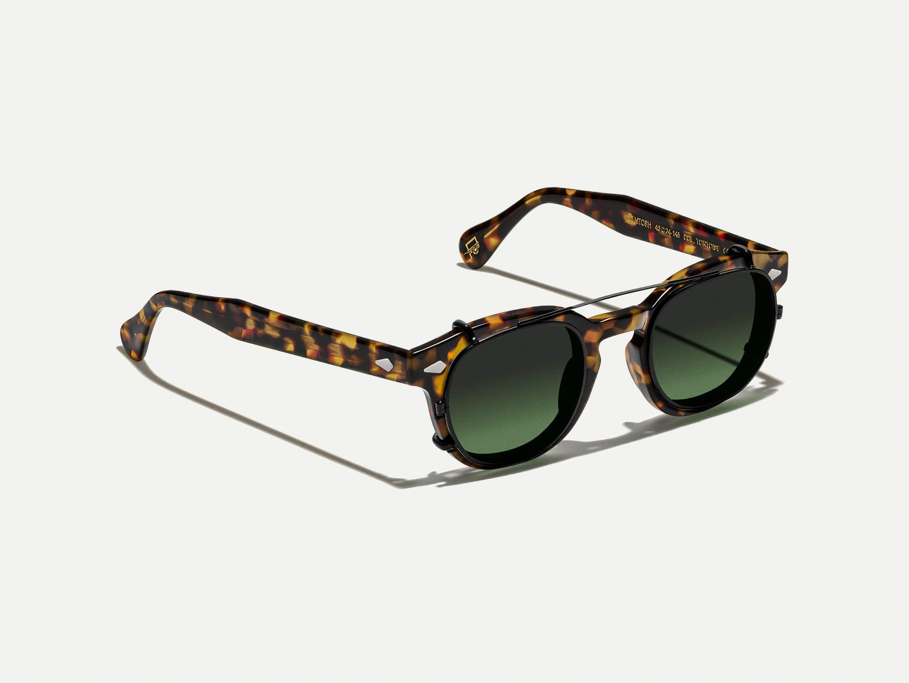 The CLIPTOSH in Matte Black with Forest Wood Tinted Lenses