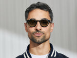 Model is wearing The CLIPTOSH in Gold in size 46 with Forest Wood Tinted Lenses