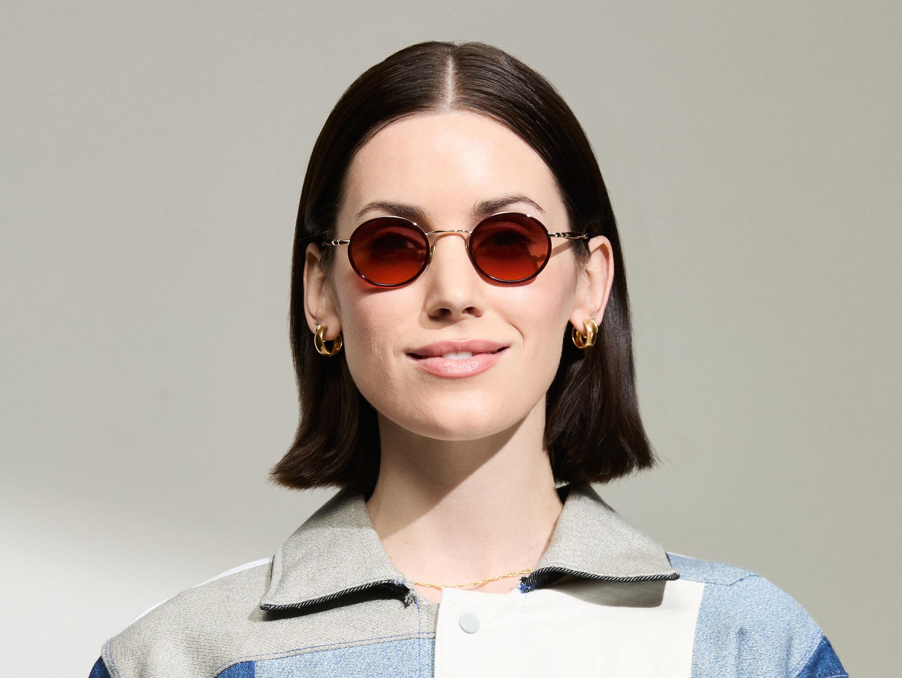 Model is wearing The COSNIC SUN in  size 44 in Burgundy with Cabernet Tinted Lenses