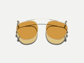 The DAHVEN CLIP in Gold with Amber Tinted Lenses