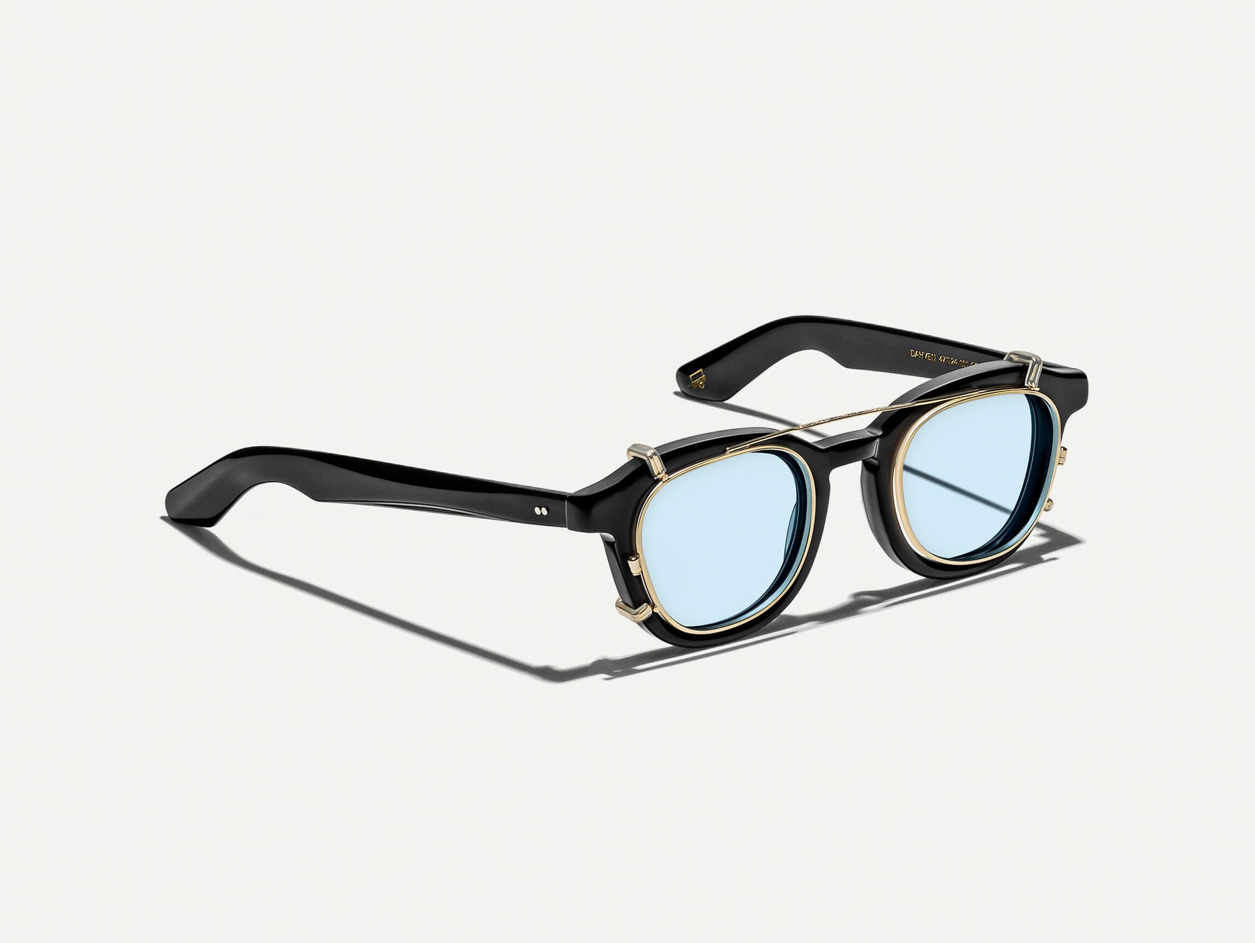 The DAHVEN CLIP in Gold with Bel Air Blue Tinted Lenses