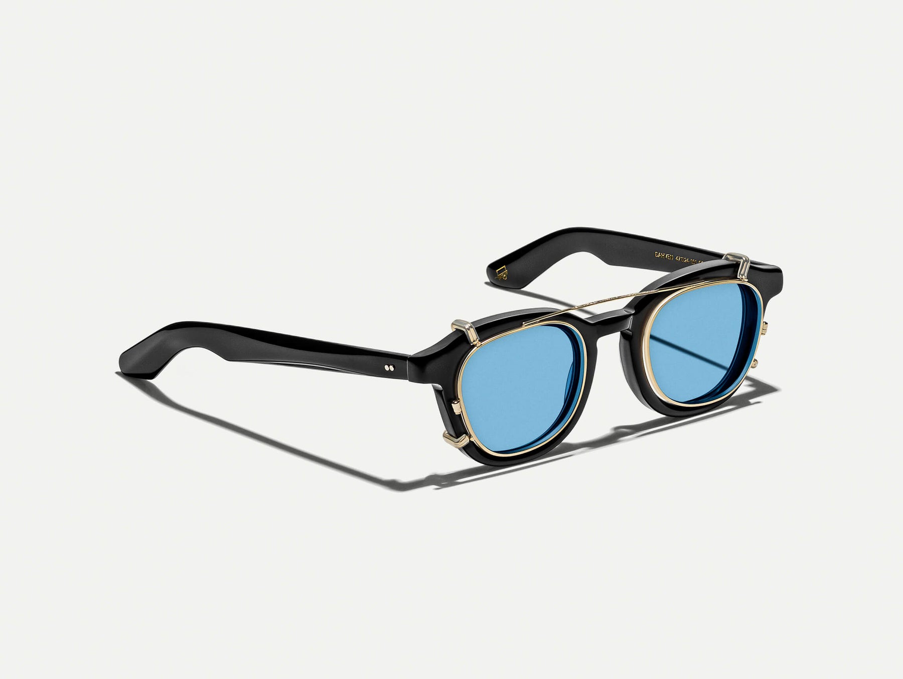 The DAHVEN CLIP in Gold with Celebrity Blue Tinted Lenses