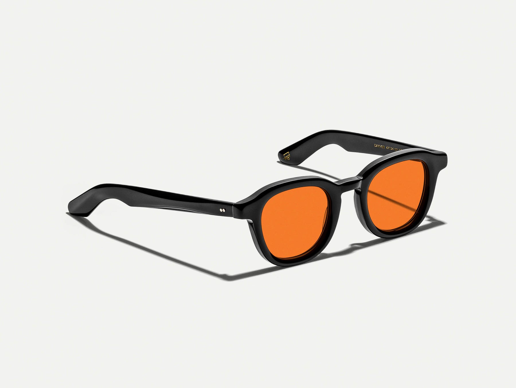 The DAHVEN Black with Woodstock Orange Tinted Lenses